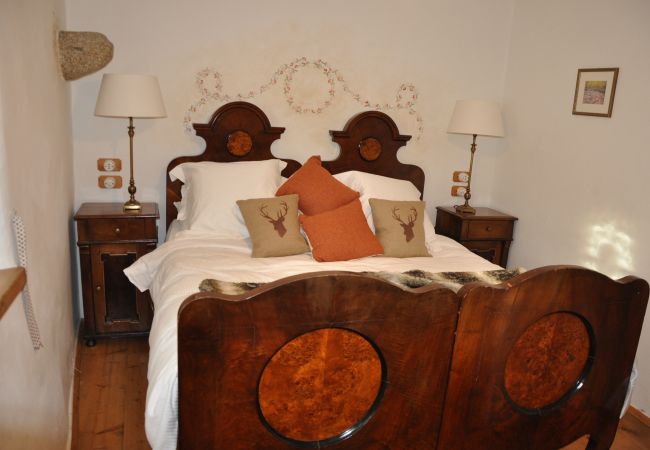 chalet-doss-campiglio-stanza-matrimoniale-appartamento-myhome-dolomiti appartamento-affitto-Madonna-di-Campiglio-Myhome-Dolomiti